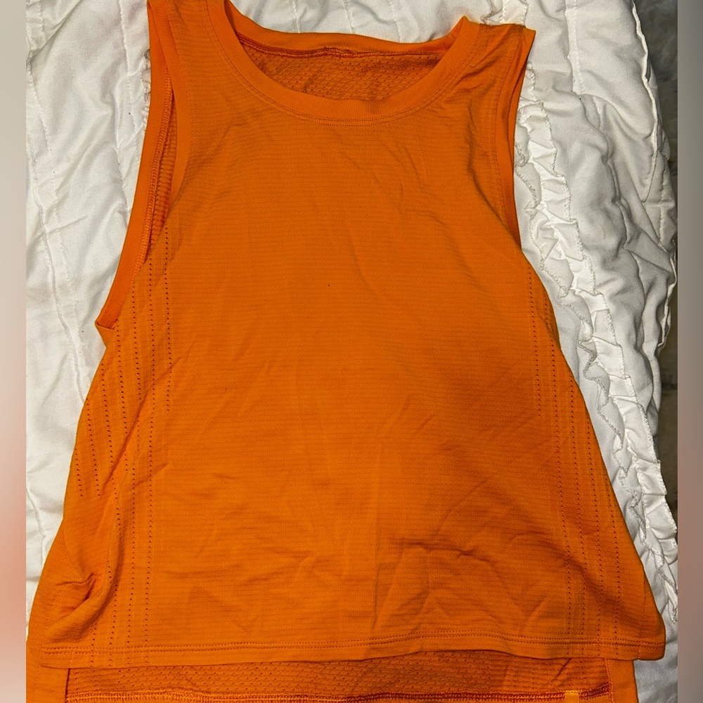Orange lululemon Train to Be tank top